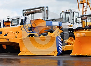 A large yellow excavator bucket. Construction machinery for sand transport. Dump truck