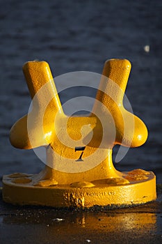 A Large Yellow Mooring Bollard