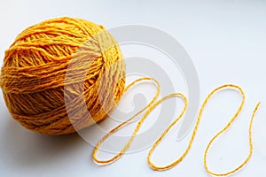 Large yellow tangle of yarn on a bright background