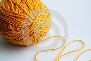 Large yellow tangle of yarn on a bright background