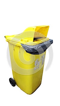 Large yellow trash can (old garbage bin) with wheel, isolated on white background