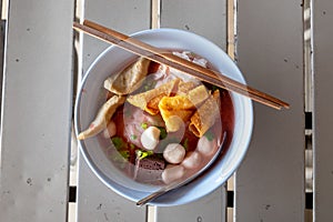 Large Yen Ta Fo Noodles on the Dining Table for Lunch. Large Noodles in Pink Soup, Asian Cousine