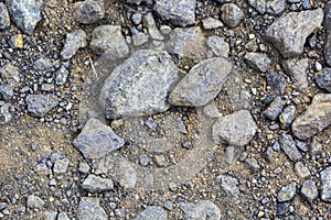 larger lumps of stone, gravel and sand as the foundation of a wind turbine