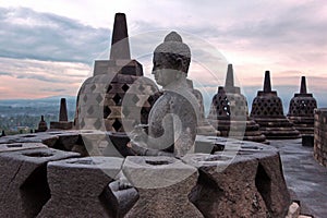 The largest Buddhist temple Borobudur in Java at sunrise time.