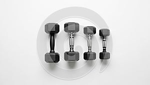 The largest dumbbell is on the left, while the smallest is on the right