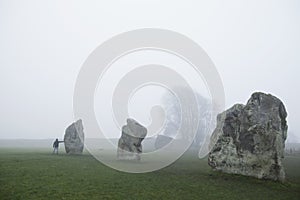 The largest stone circle in the world Avebury with person