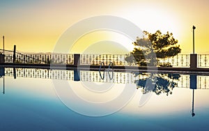 Largre swimming pool ans sunset over Chania, Crete, Greek Islands, Greece, Europea