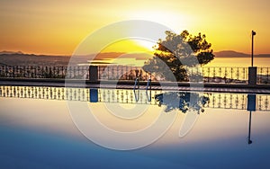 Largre swimming pool ans sunset over Chania, Crete, Greek Islands, Greece, Europea