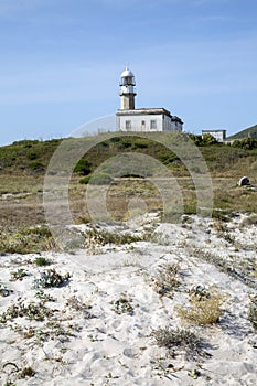 Larino Beach and Lighthouse, Coruna; Galicia photo