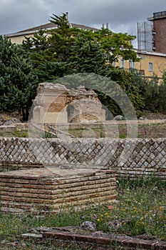 Larino, Campobasso, Roman archaeological site on the modern building background, on a sunny day photo