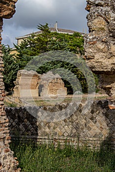 Larino, Campobasso, Roman archaeological site on the modern building background, on a sunny day photo