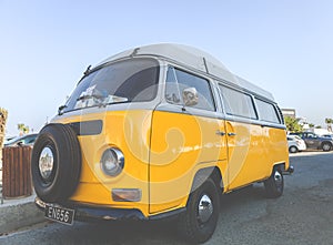 Larnaca, Greece - July 19, 2016: Classic yellow Volkswagen Transporter camper van parked on a street at Middleton beachfront.
