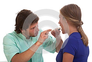 Laryngologist examining his patient