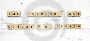 Las Jornadas del Olivar y el Aceite. words from wooden cubes with letters photo photo