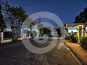 Las Pinas, Metro Manila, Philippines - Evening scene on a typical suburban street in BF Resort Village with houses photo