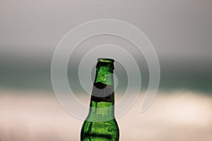 Las Terrenas, Dominican Republic, 6 april, 2019 / A bottle of famous, local Cerveza Presidente beer on the beach. iconc image photo