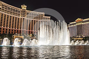 Las Vegas Bellagio Hotel Casino, featured with its world famous fountain show, at night with fountains  in Las Vegas, Nevada