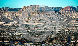 Las vegas city surrounded by red rock mountains and valley of fire