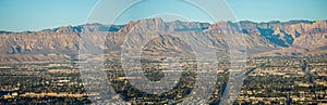 Las vegas city surrounded by red rock mountains and valley of fire
