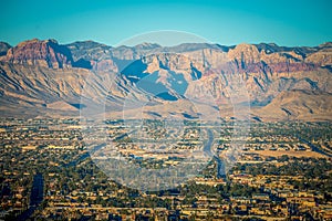 Las vegas city surrounded by red rock mountains and valley of fire