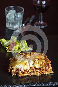 lasagna on black slate