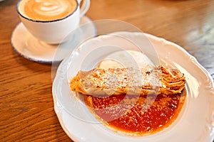 Lasagna bolognese close up. Served traditional Italian cuisine. DIsh with pasta, meat, tomato sauce, grated cheese and