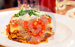 Lasagna bolognese plate, traditional recipe with tomato sauce, cheese and meat