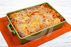 Lasagna in a green dish