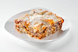 Lasagna piece on white plate close-up