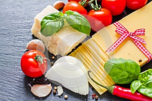 Lasagne ingredients on stone background