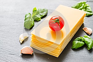 Lasagne ingredients on stone background