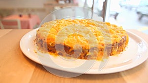 Lasagne on a plate in a restaurant