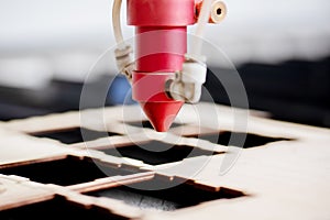 Laser CNC cutting wood. Modern machine industrial technology