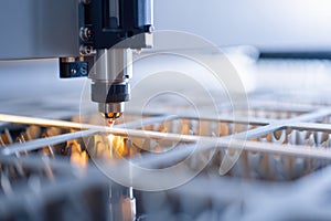 Laser cutting machine in action, showcasing precision and technology