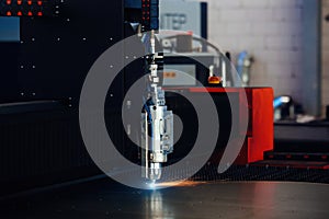 Laser cutting machine with CNC is cutting the steel sheet