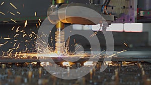 Laser cutting machine cuts metal material with sparks