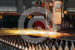 Laser cutting machine cuts the metal with sparks