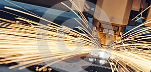 Laser cutting. Metal machining with sparks photo