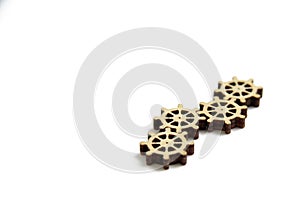 Laser cutting wooden gears on a white background