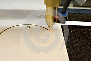 laser engraver, laser burning on wood photo