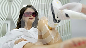 Laser epilation and cosmetology in beauty salon. Cosmetology, spa and hair removal concept