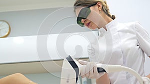 Laser epilation and cosmetology in beauty salon. Cosmetology, spa and hair removal concept