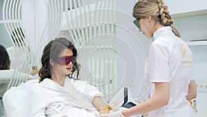 Laser epilation and cosmetology in beauty salon. Cosmetology, spa and hair removal concept