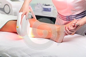 Laser epilation and cosmetology in beauty salon. Cosmetology, spa and hair removal concept