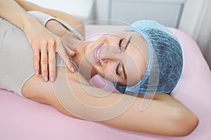 Laser epilation and cosmetology in beauty salon. Hair removal procedure. Wax depilation, cosmetology, spa, hair removal concept.