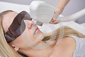 A laser facial treatment for hair removal and rejuvenation at a spa. Equipment