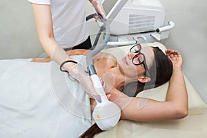 Laser hair removal and cosmetology in a beauty salon. Hair removal procedure. The concept of laser hair removal, cosmetology, spa