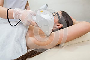 Laser hair removal and cosmetology in a beauty salon. Hair removal procedure. The concept of laser hair removal, cosmetology, spa
