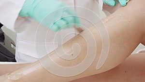 Laser hair removal procedure for legs. Beauty clinic.