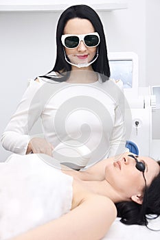Laser hair removal. Young girls. Cosmetic procedure. Modern equipment